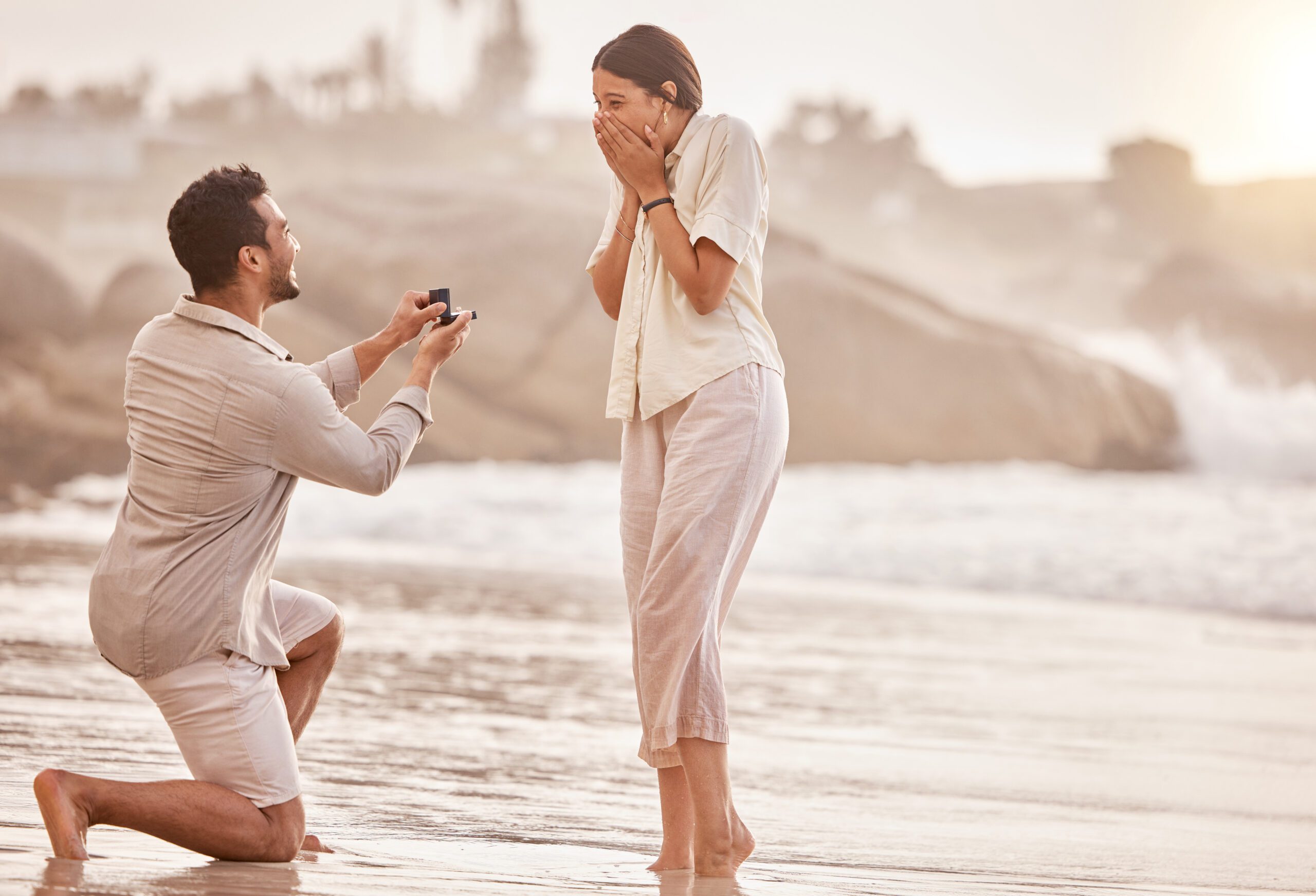 couple getting engard. Man proposing to woman at the beach. charleston, sc. Now they must ask questions before the wedding